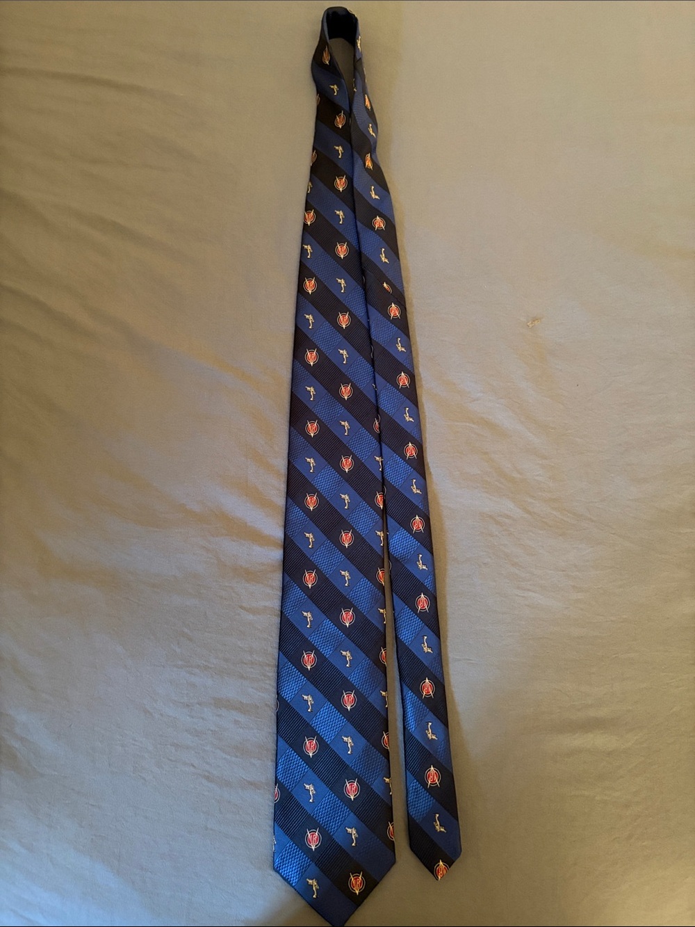 Robert Talbott Navy Blue Diagonal Stripe Tie with Red Crest Motifs-Pebble Beach